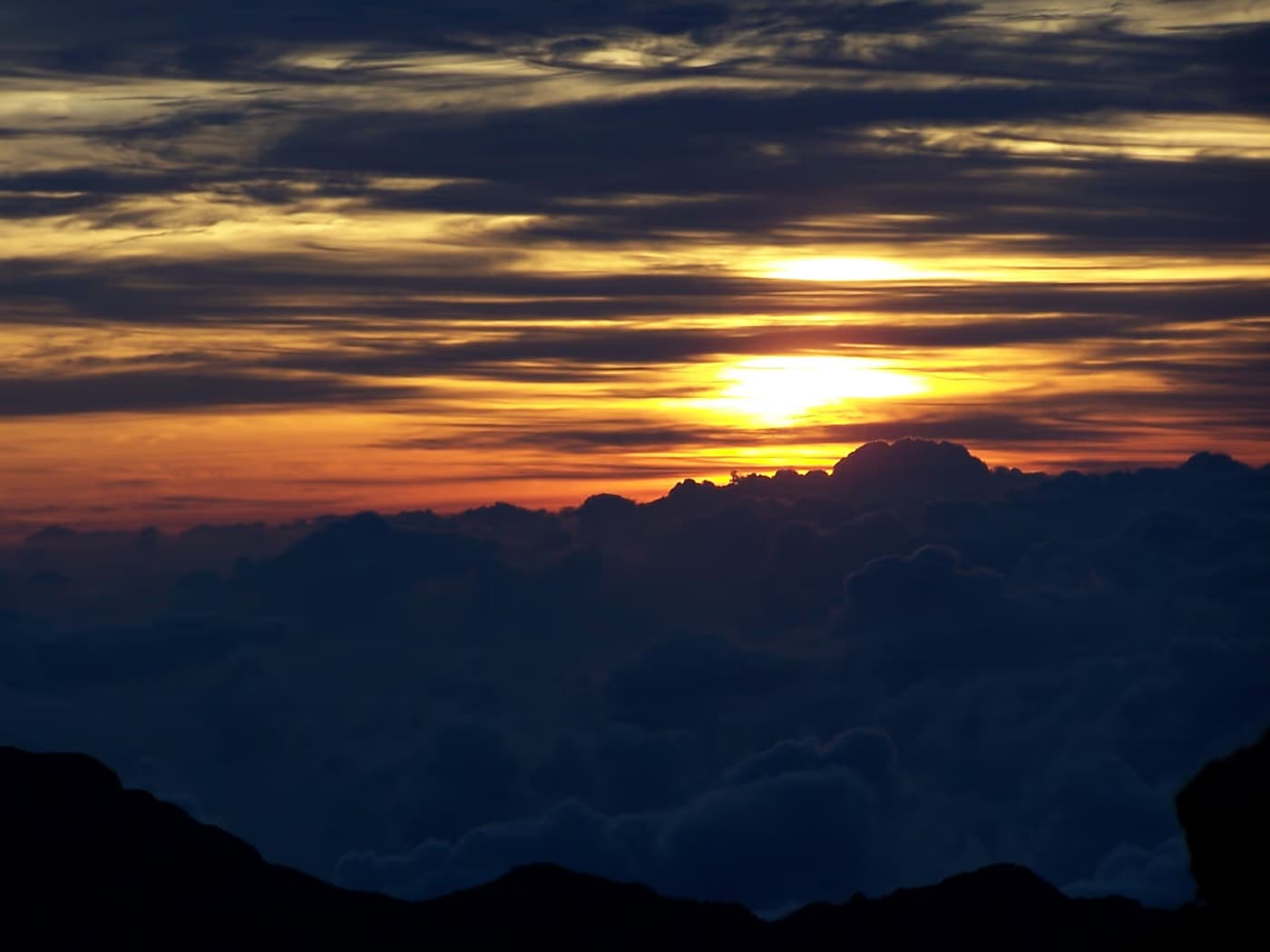 Sunrise above the clouds at the summit of Haleakala, Maui